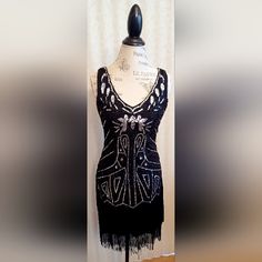 Beautiful Silver And Black Vintage Flapper Dress By Babeyond, Brand New W/Tags, Sleeveless, V-Neck, Sequined, Beaded, Black Fringe, Size S, Side Zipper, Black Base Layer, 100% Polyester. Black V-neck Flapper Dress For Party, Black V-neck Flapper Dress For Evening, Glamorous V-neck Flapper Dress For Evening, Fitted V-neck Flapper Dress, Fitted V-neck Flapper Dress For Night Out, Elegant V-neck Flapper Dress For Night Out, V-neck Flapper Dress For Party Season, Black Glamorous Flapper Dress For Party Season, Glamorous Black Flapper Dress For Party Season