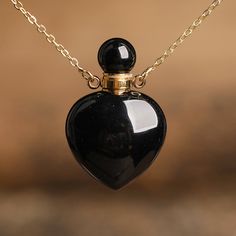 ⚫ Elevate your style and spiritual journey in one swoop with our Black Agate Crystal Perfume Bottle Necklace. This extraordinary accessory melds the elegant depth of black agate with the novelty of a refillable perfume bottle, all encased within a chic necklace. Cut from premium quality black agate, each bottle unveils an enchanting darkness, contrasted beautifully with vibrant bands and inclusions. This necklace seamlessly blends luxury with functionality, housing your most cherished scents wit Perfume Necklace, Refillable Perfume Bottle, Makeup Accesories, Handmade Crystal Jewelry, Crystal Perfume Bottles, Chic Necklace, Crystal Necklaces, Bottle Necklace, Black Agate