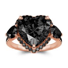 a heart shaped black diamond ring set in rose gold with diamonds on the shoulders and sides