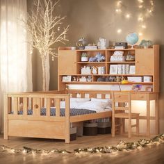 a wooden bed sitting next to a book shelf filled with books