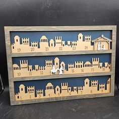 a wooden cutout of a nativity scene