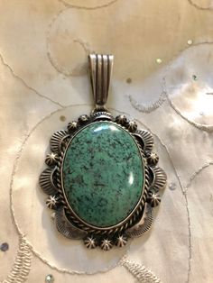 "Vintage Native American Turquoise & Sterling Silver Pendant Signed L James ( Lorenzo ), in wonderful estate condition, featuring a rare, beautiful turquoise stone, wonderfully polished, without a trace of wear, absolutely gorgeous! Pendant measures nearly 2\" long without bale and 3\" including bale and 1 3/4\" wide. We do offer combined shipping on multiple purchases. Thank you for your interest and please be sure to see our other listings for more great Jewelry, books and collectables. Wa Elegant Green Turquoise Ring, Elegant Green Chrysocolla Turquoise Necklace, Elegant Green Turquoise Necklace In Chrysocolla, Elegant Green Turquoise Chrysocolla Necklace, Green Oval Cabochon Turquoise Necklace, Vintage Untreated Turquoise Necklace, Untreated Vintage Turquoise Necklace, Oval Turquoise Necklace With Patina, Vintage Green Round Turquoise Necklace