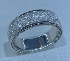 a white gold ring with diamonds on it