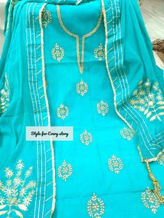 Item Overview ATHARVA Hand Embroidere Salwar Kameez in Feroze Blue w/Beautiful Embroidery Jaal/Gota Patti Dupatta/ Customized Stitching/ Wedding/ Dno. CH1434 Fabric: * Shirt: Chanderi - Feroze Blue- 2.5 Mts, with Beautiful Embroidery Neck & Jaal Embroidery * Dupatta: Chiffon Chinnon Dupatta w/Gota Patti work * Salwar: Santoon Silk 2.5 Mts. Excusive Hand Embroidered Party Wear Punjabi Suit. Customization: * Fabrics: Designs Can be made in different Fabrics. * Stitching Available Care: * Dry Clean Blue Semi-stitched Churidar With Resham Embroidery, Unstitched Blue Lawn Suit With Dupatta, Blue Embroidered Unstitched Suit In Chinon, Traditional Blue Georgette Lawn Suit, Traditional Lawn Suit With Gota Work, Light Blue Semi-stitched Dupatta For Navratri, Fitted Blue Lawn Suit With Dabka Work, Blue Georgette Lawn Suit For Diwali, Blue Bollywood Lawn Suit With Dabka Work