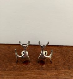 "This listing features a Vintage pair of highly collectible Sterling Silver Rasmussen Lassen DEER Clip on Earrings. The earrings beautifully capture the modernist design of Rasmussen Lassen. The earrings are very modern looking, as fashionable today as when they were created, which I believe dates to the 1960s. The earrings have clip on back closures that work properly. The earrings are in excellent condition for their age and show little to no wear to the silver. The earrings have a lovely soft Contemporary Metal Earrings For Formal Occasions, Silver Modernist Earrings For Formal Occasions, Modernist Sterling Silver Earrings For Formal Occasions, Unique Metal Earrings For Formal Occasions, Modern Hallmarked Clip-on Earrings For Formal Occasions, Modern Formal Clip-on Hallmarked Earrings, Mid-century Clip-on Earrings For Formal Events, Modernist Formal Jewelry For Pierced Ears, Mid-century Clip-on Earrings For Formal Occasions