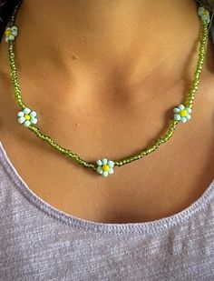 🌸 Handcrafted daisy chain bracelet or anklet made with seed beads 🌸 Necklace comes with a chain to adjust size 🌸 Silver or gold clasp and chain based on preference 🌸 A cute accessory for your summer adventures 🌸 The perfect gift for the flower child in your life, this bracelet radiates floral vibes Let us know if you have any questions, and be sure to ask about custom orders! Trendy Flower-shaped Summer Jewelry, Casual Spring Festival Jewelry, Summer Gift Beaded Bracelets With Beaded Chain, Summer Gift Beaded Chain Bracelets, Trendy Handmade Daisy Jewelry, Trendy Green Jewelry With Flower Charm, Dainty Beaded Necklaces For Spring Gift, Spring Festival Jewelry With Tiny Beads, Summer Gift Beaded Bracelets