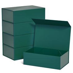 an open green box sitting on top of a white floor next to another empty box