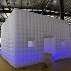 an inflatable building with blue lights inside