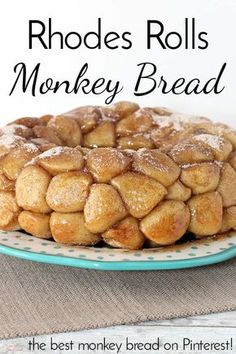 a pile of monkey bread on top of a plate with powdered sugar over it