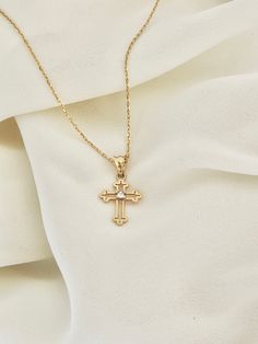 "This is a 14k yellow solid gold (not filled or plated) hollow cross necklace furnished with a tiny shiny cubic zirconia diamond. The necklace is easy to wear alone or layered with something else. This also makes the perfect gift. - 14K SOLID GOLD - WEIGHT: 2.10 gr - Necklace LENGTH: 19 3/4\" - PENDANT LENGTH: 7/8\" Each item comes in a beautiful gift box. HOW TO CARE FOR YOUR JEWELRY: + Unlike any gold-filled, plated, or vermeil jewelry that is not solid gold, wet areas, perfumes, and lotions w Diamond Cut Cross Necklace As Gift, Gift Cross Necklace With Diamond Cut, Gold Diamond Cross Necklace Gift, Gold Diamond Cross Necklace As Gift, Gold Cross Jewelry With Birthstone, Gold Cross Birthstone Jewelry, Gold Cross Necklace With Diamond Cut As Gift, Gold Diamond Cut Cross Necklace Gift, Gold Diamond Cut Cross Necklace As Gift