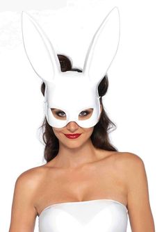 a woman wearing a white bunny mask on her face