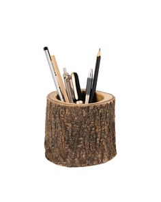 pencils and pens are in a wooden holder