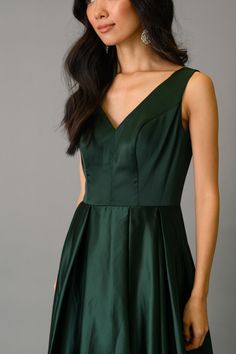 Got the Fit and Flare for your mornings? Now, get a load of its evening version. Introducing: The Flare Formal Dress, an envy-inducing, unironically green gown. Add a flare to your strut and some contours to your silhouette without compromising on comfort. In the Spotlight Featured in the spring/summer collection A dark green color from shoulder to ankle Gloriously sleeveless A slight back tail stopping just short of the ground A fully-pleated skirt 100% lined A V-neckline at the front and a dee The Flare, Dark Green Color, Green Gown, In The Spotlight, Spring Summer Collection, Formal Dress, Formal Occasion, Fit & Flare, First Look