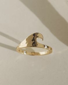 Material: 10k gold plated over brass Dimensions: 9mm (ring face) Coastal Fits, Ocean Rings, 9mm Ring, Gold Thumb Rings, Beach Rings, Surfer Jewelry, Unique Gold Rings, Gold Wave Ring, Summer Rings