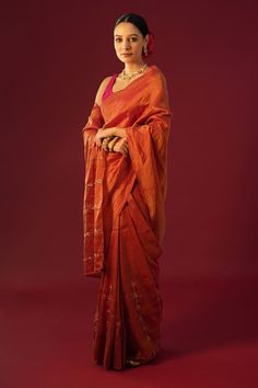 Rust saree with placement hand embroidery. Paired with a padded blouse. - Aza Fashions Slub Silk Pre-draped Saree With Zari Work For Puja, Pre-draped Saree For Puja Festivals, Silk Pre-draped Saree With Dori Work For Puja, Festive Embroidered Slub Silk Pre-draped Saree, Chanderi Pre-draped Saree With Dori Work For Puja, Orange Pre-draped Saree With Zari Work, Transitional Silk Saree With Dori Work, Festive Raw Silk Pre-draped Saree, Navratri Silk Pre-draped Saree With Dori Work