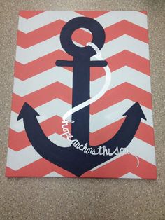 an anchor painted on a canvas with white and red chevrons in the background