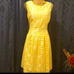 Women Yellow Knee-length Midi Dress For Spring, Yellow A-line Sundress, Elegant Yellow Fit And Flare Dress, Yellow Knee-length Midi Sundress, Yellow Lined Fitted Midi Dress, Yellow Fitted Lined Midi Dress, Yellow Fitted Midi Dress With Lining, Yellow Fitted Midi Dress, Lined, Yellow Lined Midi Dress For Summer