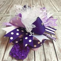 You will love this Big Purple Boutique Over the Top Hair Bow by Beautiful Bows Boutique! - made with premium grosgrain ribbon - available in 4", 5", or 6" size - available on an alligator clip, french barrette, or as a bow and headband set - bow is for all ages including babies and big girls - can be worn with or without a headband - customization or headband substitution available upon request - Please contact me with any questions and I will be glad to help:) Purple Boutique, Sports Hair Bows, Baby Hair Bows Headbands, White Baby Headband, Handmade Baby Headbands, Purple Hair Bows, Stacked Hair Bow, Baby Headbands Crochet, Big Hair Bows