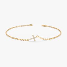 Natural Diamond Cross Bracelet: This 14k gold bracelet features a dainty sideways cross adorned with sparkling diamonds (0.3 ctw, G color, SI clarity), available in yellow, rose, or white gold. Perfect Gift for Her: Ideal for expressing faith, this elegant and stackable bracelet adds a touch of sophistication and spirituality to any outfit. High-Quality Craftsmanship: Made with solid 14k gold and securely set natural diamonds, ensuring lasting beauty and durability. Versatile and Stylish: The timeless design and 5 x 7 mm cross make it suitable for everyday wear and special occasions, offering a chic and meaningful accessory. * SKU- SABR 545 𝐑𝐞𝐭𝐮𝐫𝐧 𝐏𝐨𝐥𝐢𝐜𝐲 100% Satisfaction Guaranteed & Hassle-Free Return. You will get 𝐟𝐮𝐥𝐥 𝐫𝐞𝐟𝐮𝐧𝐝 or 𝐞𝐱𝐜𝐡𝐚𝐧𝐠𝐞 within 𝟑𝟎 𝐝𝐚𝐲? Gold Cross Bracelet, 1st Communion, Gold Armband, Diamond Choker, Dope Jewelry, Accessories Ideas, Diamond Cross, Stackable Bracelets, Jewelry Lookbook