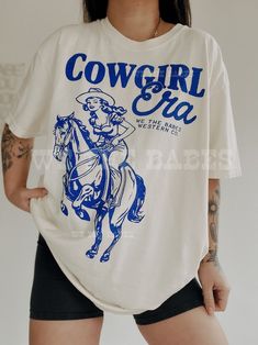 Cowgirl Era Tee  Vintage inspired western aesthetic trendy graphic tee Easy 30 day return policy Spring Graphic Print T-shirt For Rodeo, Trendy Relaxed Fit T-shirt For Rodeo, Spring Graphic Tee For Rodeo, Graphic Tee For Rodeo And Spring, Spring Rodeo Graphic Tee, Spring Letter Print T-shirt For Rodeo, White Graphic Tee For Rodeo, Graphic Print Crew Neck T-shirt For Rodeo, Retro Summer T-shirt For Rodeo