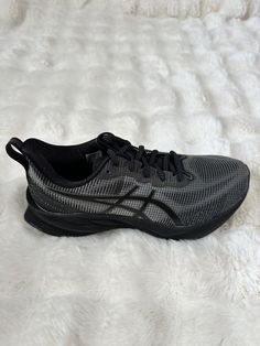 Step up your running game with these ASICS Novablast 3 LE sneakers. Designed with a low top shoe shaft style and lace-up closure, they provide a comfortable and secure fit during your outdoor or city runs. The black mesh upper material offers breathability and durability, while the foam insole material ensures a cushioned feel with every stride. These athletic sneakers are perfect for activewear or casual occasions, and with their classic and sports-themed design, they're sure to become a favorite in your shoe collection. Make them yours today, and experience the exceptional performance and activity they provide. Asics Novablast 3, Sports Theme, Athletic Sneakers, Black Mesh, Top Shoes, Step Up, Shoe Collection, Low Top, The Black