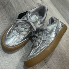 Guess Metalic Silver Casual Shoes Brand New. Very Comfortable. Very Stylish. Trendy Synthetic Closed Toe Sneakers, Trendy Synthetic Closed-toe Sneakers, Metallic Round Toe Casual Sneakers, Casual Metallic Sneakers With Round Toe, Metallic Sneakers With Round Toe For Spring, Trendy Metallic Round Toe Sneakers, Spring Metallic Sneakers With Round Toe, Casual Metallic Sneakers, Gold Synthetic Sneakers For Summer