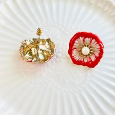 Add a pop of color to your ensemble with our beautiful Red Poppy Flower Stud Earrings. The vibrant red petals and delicate pearl center make these earrings a sophisticated choice for any occasion. Expertly crafted and designed for lasting wear. Dimensions: 2.5cm*2.4cm Materials: Enamel, alloy, pearl, 925 silver needles Elegant Red Flower Earrings, Red Flower Charm Earrings, Red Drop Earrings With Flower Charm, Red Flower Earrings For Wedding, Red Earrings With Flower Charm For Gift, Red Jewelry With 3d Flower Details, Red Earrings With 3d Flowers For Gift, Red Petals, Red Poppy