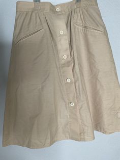 Geoffrey Beene Sport Tan A-line Knee Length Button Skirt Women's Size Small Geoffrey Beene Sport Tan A-line Knee Length Button Skirt Women's Size Small.  With nice front pockets. In very good vintage condition. No size Meas est 29-30" waist, 23" length. It fits me and I can be a small to -XS depending on brands. This is an adorable skirt.50%cotton 50% polyester. Geoffrey Beene, Button Skirt, Knee Length, Womens Skirt, Art Collection, A Line, Bathing Beauties, Display Homes, Womens Sizes