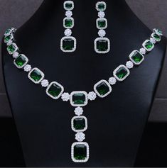 Handmade Necklace with Earrings American diamond and Emerald Necklace set with earings. This beautifully handcrafted necklace is set in sterling silver 925. Pose your festive best with this necklace..  It will go with everything and make your outfit super chic. Diamond -- American  Diamonds  Diamond Wt --22.39ct approx Diamond Shape -- Round Gemstone-- Emerald (Lab created)  Metal -- Sterling Silver  Silver Wt.  -- 35.800gm Silver Purity--92.5%  Necklace Finish Antique gold                   Nec Emerald Necklace Set, Necklace Set With Earrings, Zircon Necklace, Gold Necklace Set, Wedding Bridal Jewellery, Classy Jewelry, Emerald Necklace, Yellow Gold Engagement Rings, Handcrafted Necklace