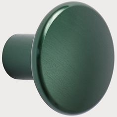 an image of a green door knob on a white background with clipping for text