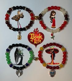 a bunch of bracelets that are hanging on a wall with some charms attached to them