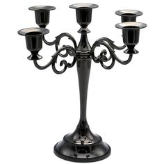 a black candelabra with five candles on it