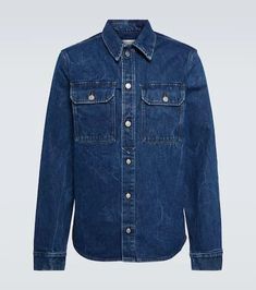 Tap into the trend for Western-inspired fashion with this slim-fit denim shirt from Dries Van Noten. The dark indigo blue wash is offset by brown topstitching, flap patch pockets, and rivet buttons..Care instructions: machine wash at 30 degrees.Closure: buttoned front.Made in Italy.Material: 100% cotton.Pockets: breast pockets, flap pockets.True to size.Straight fit.Mid-weight material.Falls to the hip.The model in the picture is 185cm-6'1' and wearing a size IT 48 Casual Dark Wash Denim Top With Patch Pockets, Dark Wash Cotton Denim Top With Snap Buttons, Dark Wash Denim Top With Snap Buttons, Indigo Denim Top With Patch Pockets, Indigo Denim Tops With Patch Pockets, Utility Style Medium Wash Denim Top, Dark Wash Denim Top With Patch Pockets, Denim Blue Tops With Patch Pockets, Printed Denim Shirt