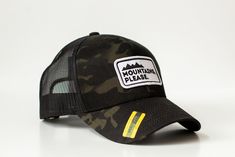 Mountains, Please. Trucker Hat - Camo in the front, black in the back. 65/35 polyester/cotton Mesh back, structured Mid-profile, six-panel Snapback closure Black Six-panel Snapback Hat For Summer, Black Military Summer Hat, Black Trucker Hat For Travel, Black Six-panel Summer Hat, Black Six-panel Trucker Hat For Summer, Black Snapback Trucker Hat For Travel, Black Military Snapback Hat With Curved Bill, Black Military Trucker Hat For Outdoor, Travel Black Snapback Hat With Flat Brim