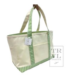 The New Midi Tote in coated canvas - is perfect for day-to-day, beach, groceries, and getaways. This roomy interior can carry a 17" laptop, change of clothing and our other TRVL accessories. Designed with Signature coating that is wipeable and machine washable Includes front exterior pocket and inside key clip strap. Size: 13"| (base) x 10.5"h x 6"d - top width 19" Handle Drop: 8.25" Cotton canvas with Signature * Coating Set-in collar with Chunky White Zipper closure Key Ring Keeper Water and stain resistant & wipeable inside and out Care: wipe with a clean damp cloth Green Canvas Bag With Canvas Lining For Travel, Green Rectangular Canvas Bag For The Weekend, Green Rectangular Canvas Bag For Weekend, Green Canvas Tote Travel Bag, Green Canvas Rectangular Weekender Bag, Green Rectangular Canvas Weekender Bag, Cotton Beach Bag With Pockets For Travel, Cotton Beach Bag With Canvas Lining For Travel, Casual Beach Bag With Canvas Lining For Travel