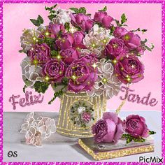 purple flowers in a gold vase on a pink and white background with the words feliz fauble next to it