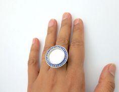 Design code: PB-9399-RHandcrafted in sterling silver with mirror top and fine hand-painted enamel work.Dimensions: Approximate diameter is 2.5 cms. Ring size: adjustable. Enamel Ring, Round Mirror, Jaipur India, Finger Ring, Round Mirrors, Ring Finger, Jaipur, Fair Trade, Gemstone Rings