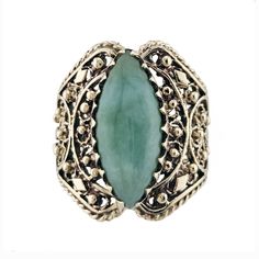 Fancy a bit of filigree? This vintage 14K gold ring is a stunning example of the craft! The wide band features a marquise aventurine cabochon in a gorgeous green hue that is set in a serrated bezel. From front to shank, the handmade ring is comprised of scrolly, lacy detail and ropework for an elegant ethnic vibe. Vintage: 1970s to 1990s Size: 7 Materials:  Solid 14K Gold, Aventurine Marked: indiscernible mark (tested 14K) Aventurine: elongated marquise cabochon, approx. 18mm x 7.5mm Width North to South: 7/8" Width East to West: 3/4" Stands Off Finger: 5/16" Shank Width: 5/16" Weight: 4.9 dwt / 7.7 g / .24 ozt Condition: Excellent vintage condition FREE PRIORITY SHIPPING IN U.S.! Signature confirmation is included unless buyer requests otherwise. GUARANTEED AS LISTED OR YOUR MONEY BACK! U Elegant Oval Jewelry With Patina, Vintage Oval Carved Filigree Ring, Bohemian Oval Filigree Ring With Intricate Design, Vintage Oval Emerald Ring With Intricate Design, Ladies Silver Rings, Vibe Vintage, Aventurine Ring, Resize Ring, Filigree Jewelry