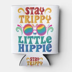 a white can holder with the words stay trippy little hippie on it and sunglasses