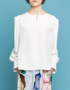 This silk crepe blouse with our signature puff sleeves and front key-hole detail is a must have in your wardrobe. It's an exclusive feminine staple pieces which you easily combine with all your skirts and trousers already hanging in your wardrobe. It's our most versatile piece and you can literally wear it during all occasions. This piece is crafted with love for detail and has fabric covered button closure in front as well on the puff sleeve cuffs. The back is longer than the front and the heml Blouse With Puff Sleeves, Crepe Blouse, Garment Industry, Body Curves, Fabric Covered Button, Personalized Clothes, Professional Look, Key Hole, Silk Crepe