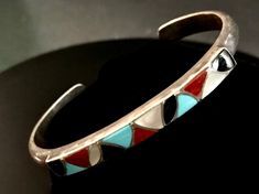 Sterling Silver - Zuni Navajo Silver and Multi-stone Inlay Cuff Bracelet, 23.43g. Fits Up To 6 3/4" Wrist. Marked: Sterling, SKJ  ( Zuni Skj Sibert & Janita Kallestewa ). Inlay Consists of Black Onyx; Turquoise; Red Coral and Mother of Pearl Shell.. Stone Inlay, Southwestern Jewelry, Pearl Shell, Multi Stone, Red Coral, Black Onyx, Cuff Bracelet, Mother Of Pearl, Cuff Bracelets