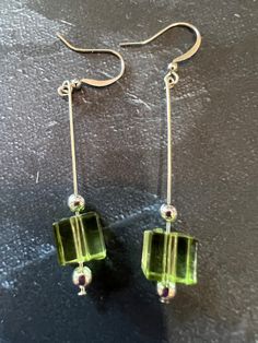 This light weight earring is simple but elegant. The vibe is a very light green. Silver beads accent this earring. Square Glass Beads Jewelry Ideas, Square Bead Earrings, Small Bead Earrings, Earring Making Ideas, Simple Bead Earrings, Diy Earrings Dangle, Sundance Jewelry, Earring Inspiration, Diy Jewelry Display