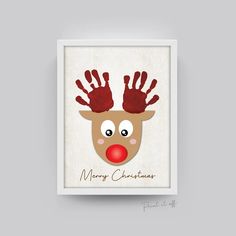 a christmas card with a reindeer's face and hands