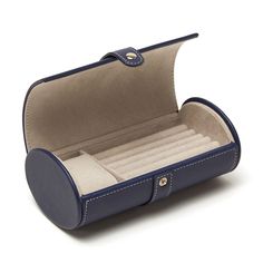 Brouk and Co. - Brouk & Co. "Riley" Blue Faux Leather Travel Jewelry Roll. From Brouk & Co., this "Riley" navy-blue faux leather compact travel jewelry roll is perfect for your favorite watch and signature accessories. Features a soft, ultra-suede interior and separate pillow rows to hold cuff links, rings, earrings and more, making this a great item for both women and men. Vegan friendly. Wipe clean. Measures 7"L x 3 3/4"W x 2 3/4"H. Item(s) are safely and securely packaged. Riley Blue, Jewelry Roll Travel, Jewelry Roll, Watch Storage, Fine Jewelery, Jewelry Organizer, Travel Jewelry, Leather Travel, Travel Light