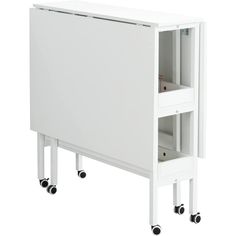 a white cabinet sitting on wheels next to a wall