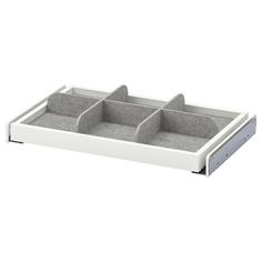 a white and grey tray with three compartments