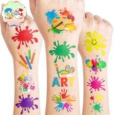 three children's hands with different colored paint designs on their arms and feet, one holding a clock