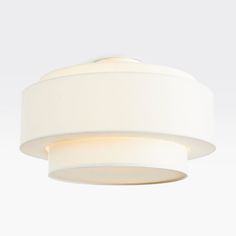 a white ceiling light with two lights on each side and a circular shade hanging from the ceiling