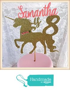 a pink cake with a gold unicorn on it and the name sannaha is printed on top