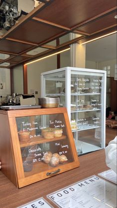 a bakery counter with donuts and pastries on display